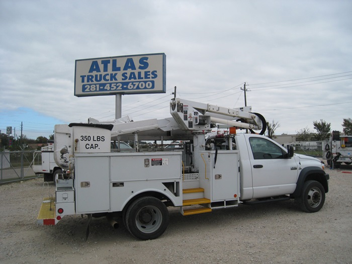 Sterling Bullet bucket truck with crub side access.