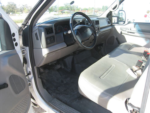 Bucket truck interior with bench seats.
