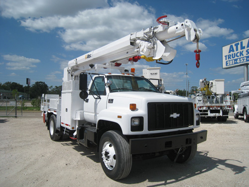 Digger truck with pole claws & boom tip winch.