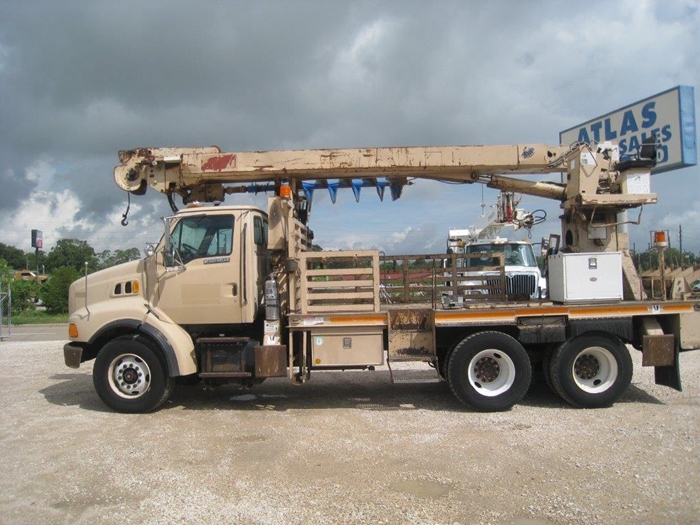 Digger Truck with outriggers.