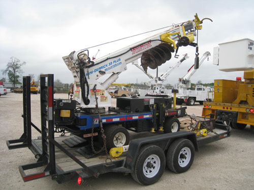 Backyard digger with tandem axle trialer.