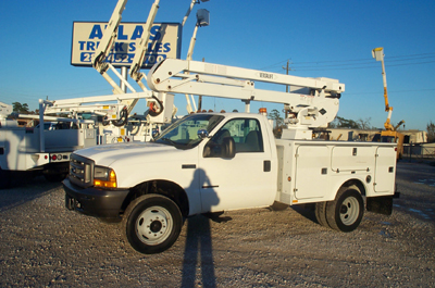 This bucket truck has an over center insulated bucket.