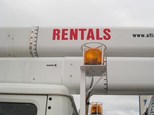 Bucket truck rentals with yellow flashing beacons.