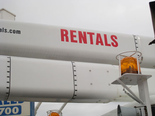 Bucket truck with yellow flashing lights.