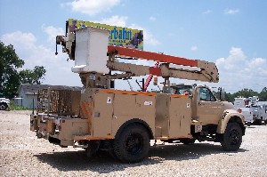 Bucket mounted over center bucket truck.