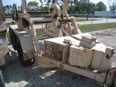 Gas motor on a reel trailer.